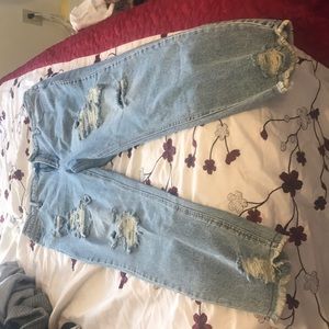 Brand new, never worn, ripped mid waist jeans.